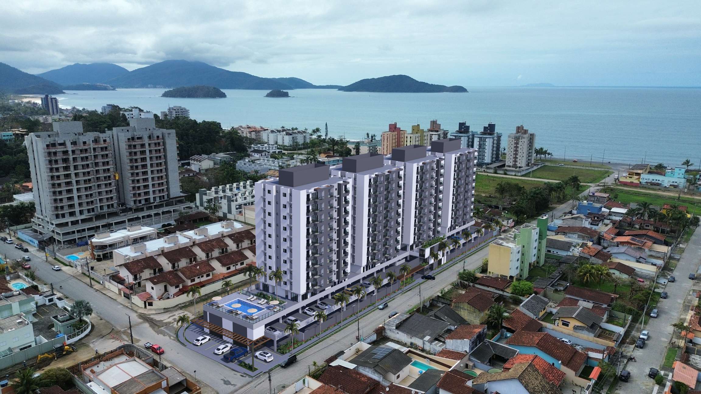 Vista aérea do Residencial Sardenha com o mar de Caraguatatuba ao fundo